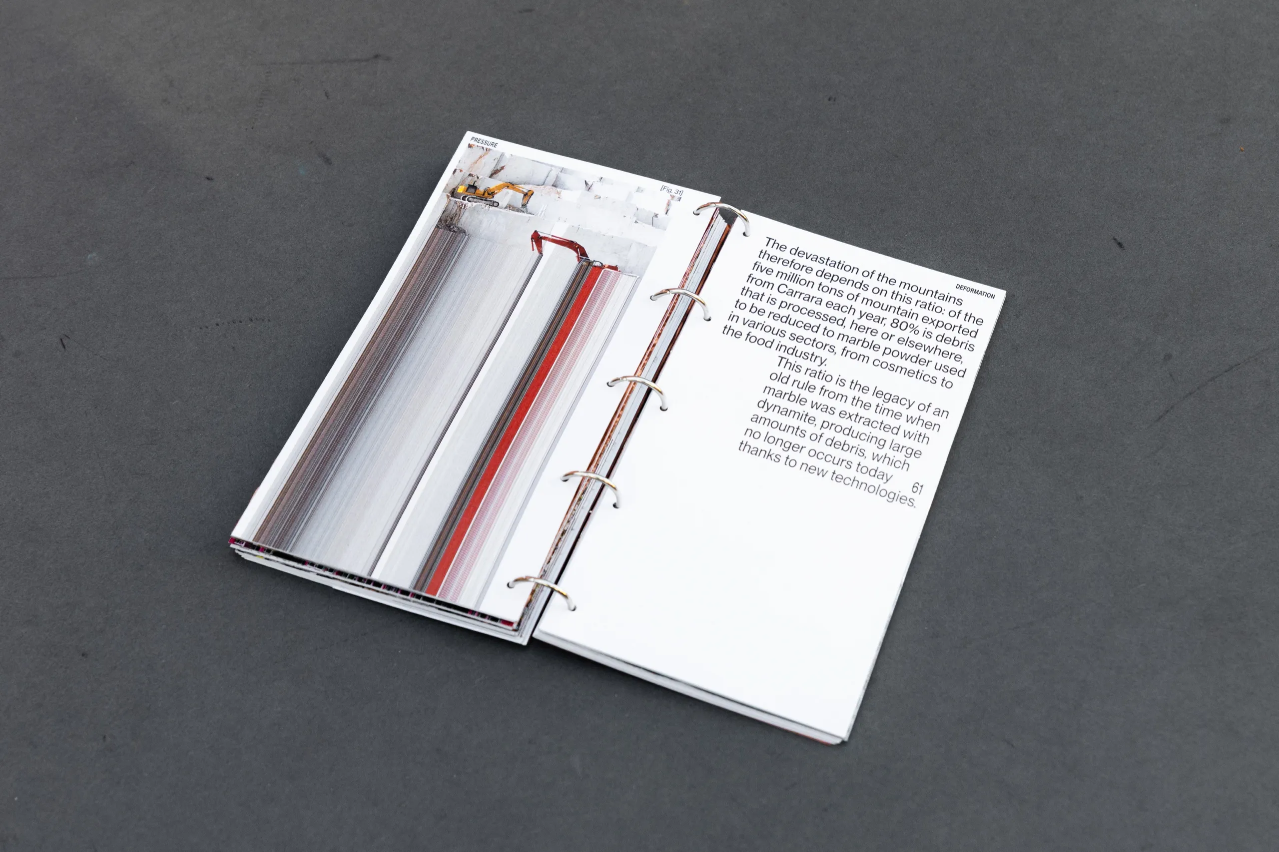 Hostilia open on a spread about the extraction of marble from the mountains